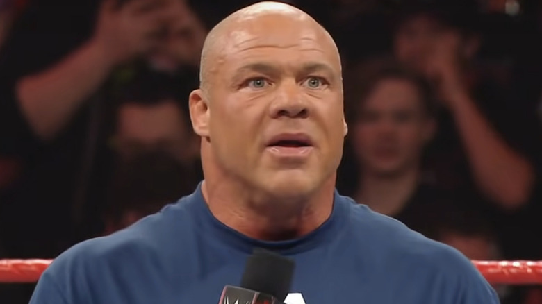 Kurt Angle speaks into a microphone