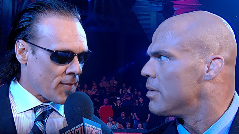 Kurt Angle and his wife smiling backstage