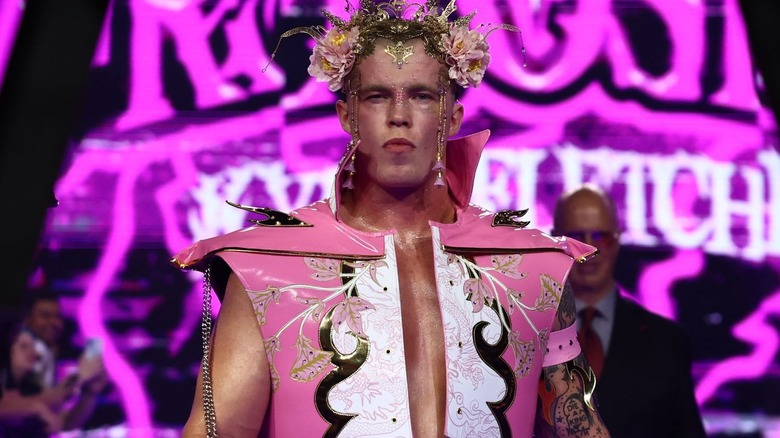 Kyle Fletcher wearing a pink ring jacket