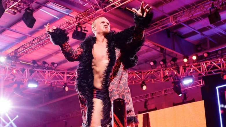 'WWE NXT" star Ilja Dragunov poses on the turnbuckle prior to a match.