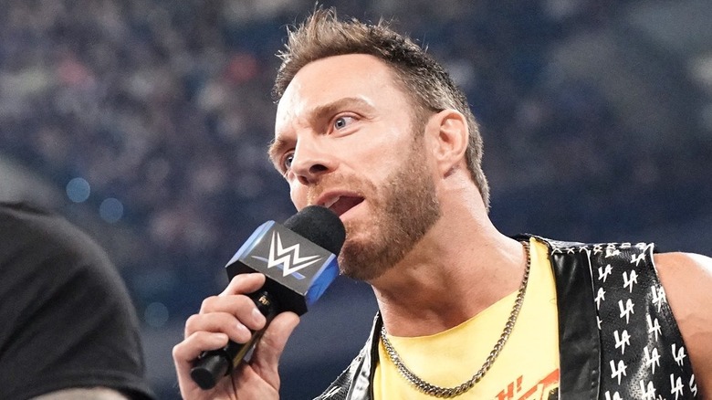 LA Knight holding WWE mic
