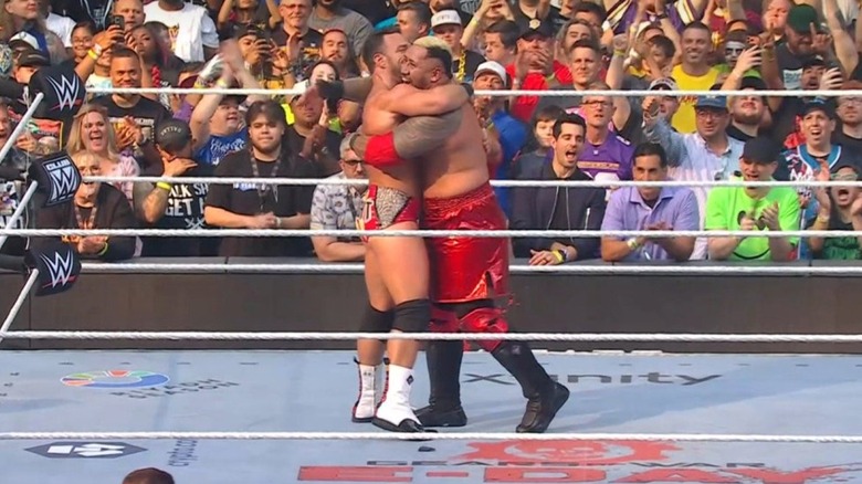 Solo Sikoa and LA Knight hug it out