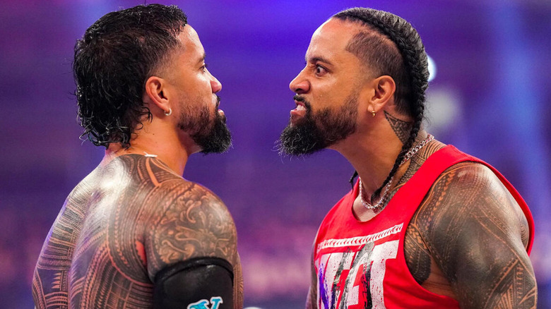 Jey and Jimmy Uso staring at each other