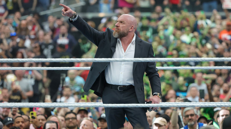 Triple H does the iconic finger point to the WWE WrestleMania 41 sign as he kicks off the festivities