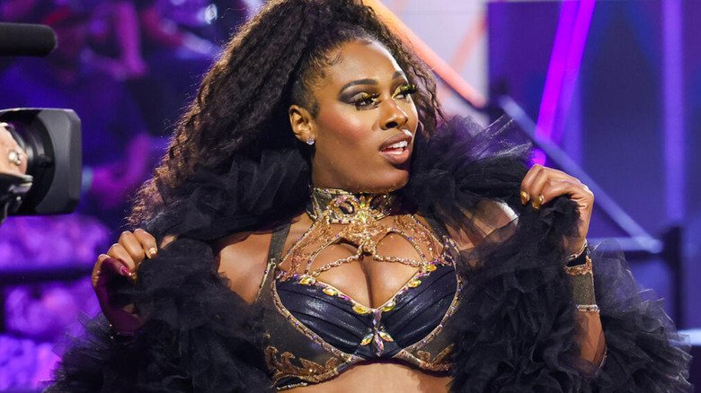 Lash Legend wearing a black jacket