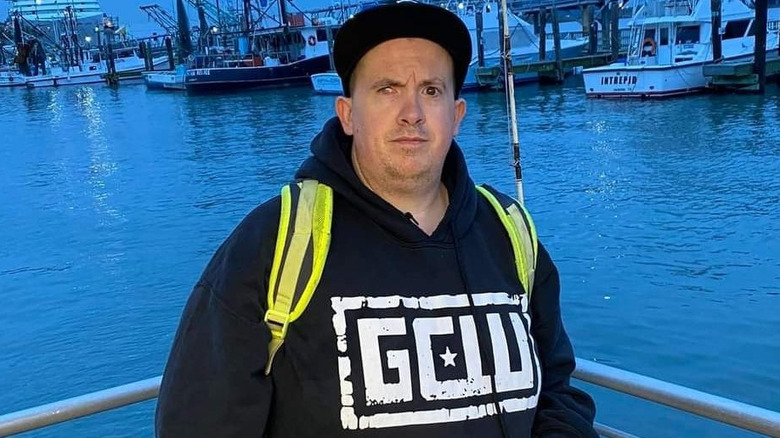 Mike Bieszck wearing a GCW hooded sweater