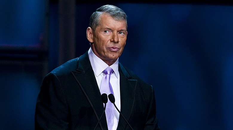 Vince McMahon looks on before giving a speech.
