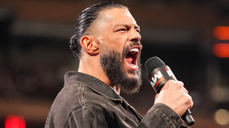 Roman Reigns yelling into a WWE mic