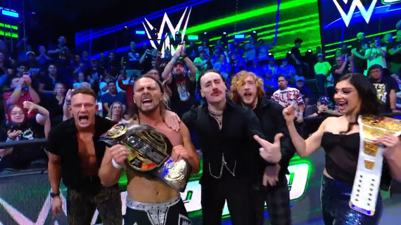 Lexis King celebrates with Birthright after winning the WWE Men's Speed Championship