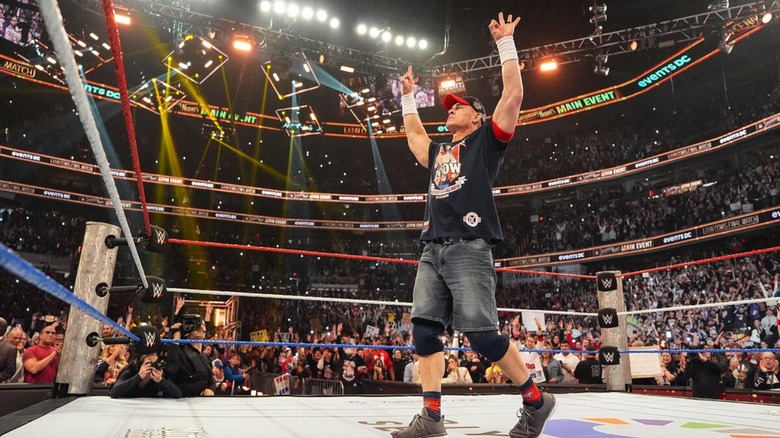 John Cena looks to the fans and poses in the ring at Saturday Night's Main Event ahead of his retirement match.