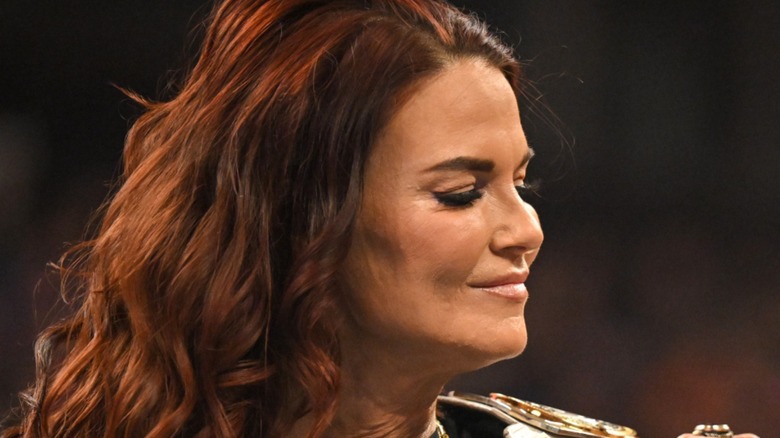 Lita looking on pleased with herself