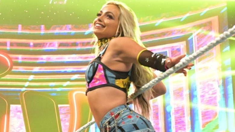 Liv Morgan sits on the ring ropes