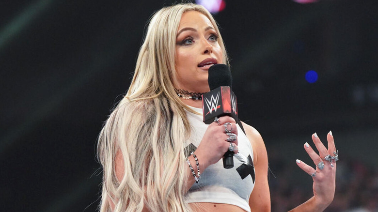 Liv Morgan talking on a microphone.