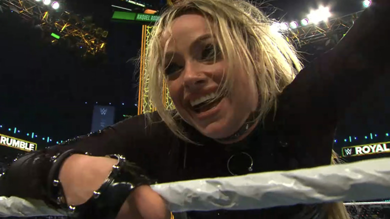 Liv Morgan smiles as she leans on the rope.