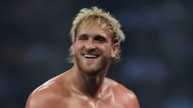 Logan Paul taking a moment to grin while wrestling