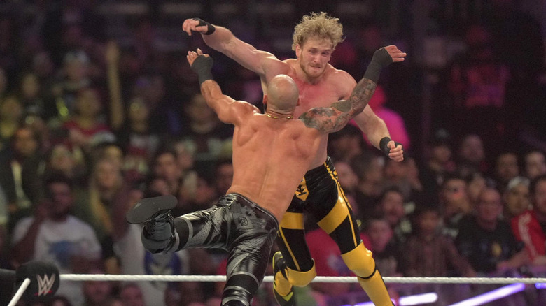 Logan Paul and Ricochet colliding in the air