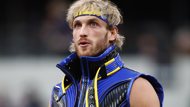 Logan Paul wearing blue and yellow ring gear