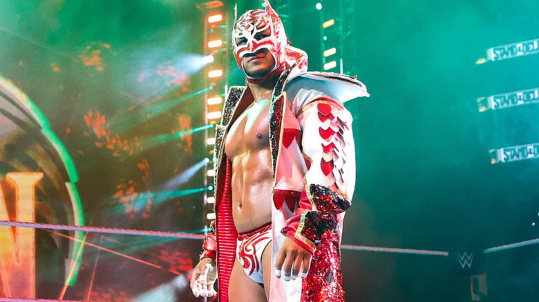 Dragon Lee wearing a red and white mask