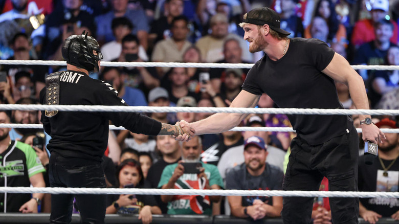 Logan Paul shaking Rey Mysterio's hand