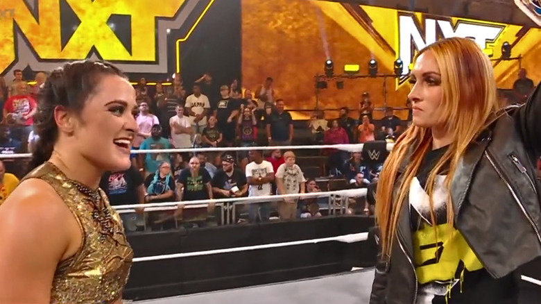 Lyra Valkyria and Becky Lynch staring at each other