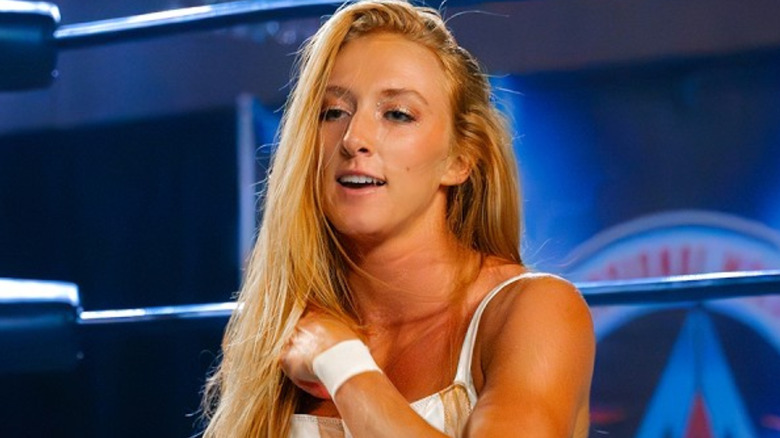 M By Elegance wearing white ring gear