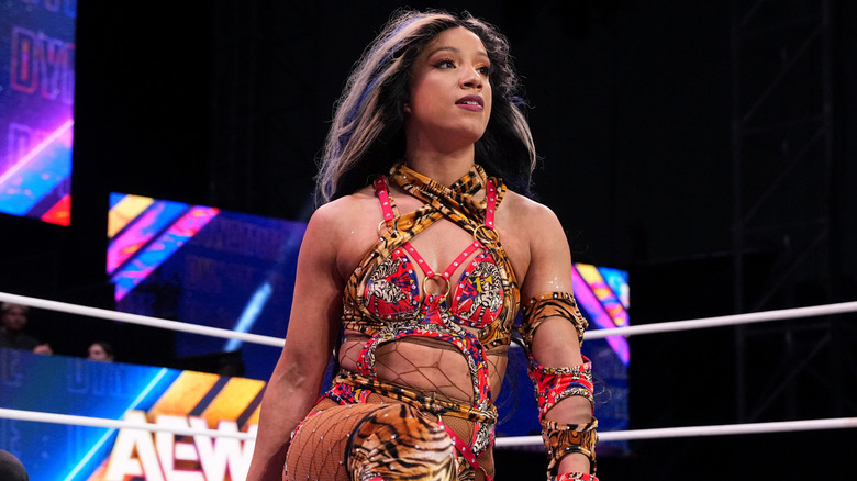 Mercedes Mone looks triumphantly in the ring to the crowd during a TBS Championship defense on 