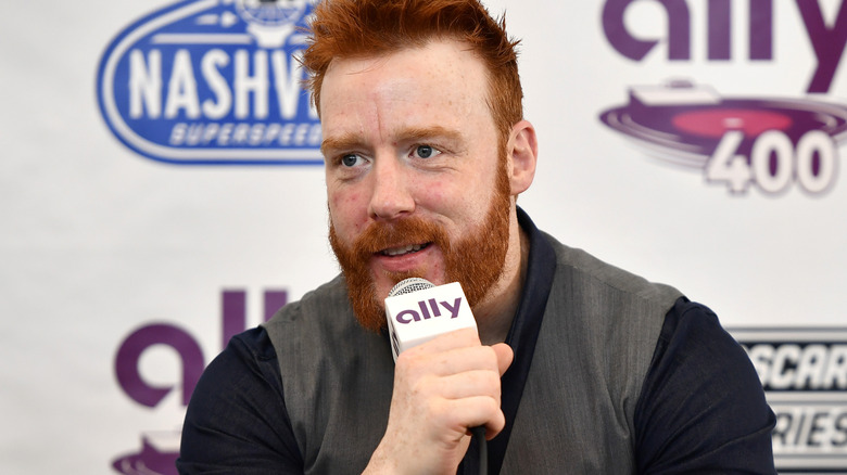 Sheamus holding a microphone