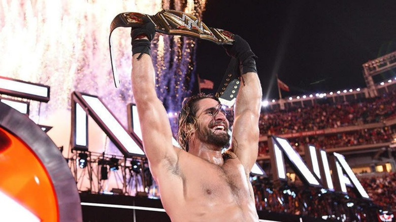 Seth Rollins holds title