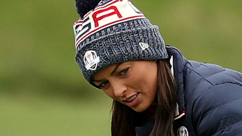 Mandy Rose watches putt