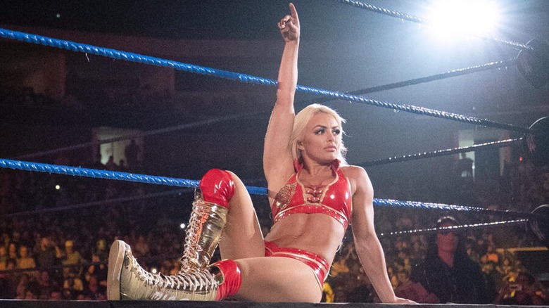 Mandy Rose posing on the ring apron