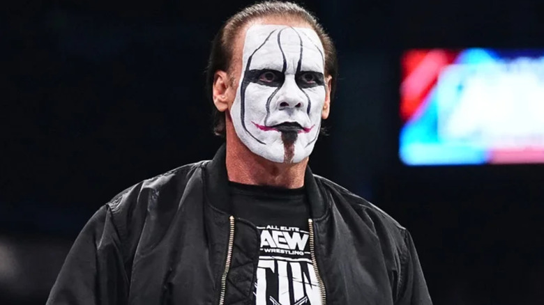 Sting wearing black and white face paint 