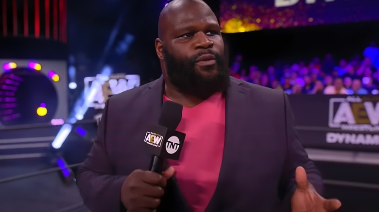 Mark Henry holding a mic