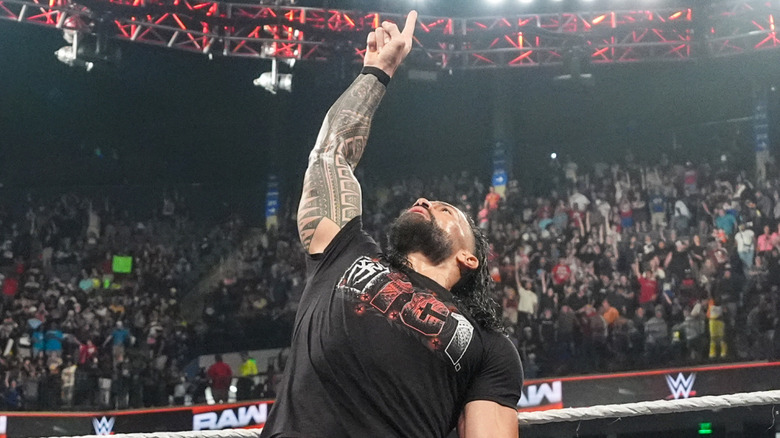 Roman Reigns doing his signature pose after making his WWE return during 
