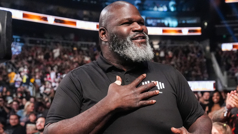 Mark Henry holding a hand over his chest
