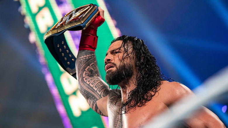 Roman Reigns holding up the Undisputed WWE Universal Championship