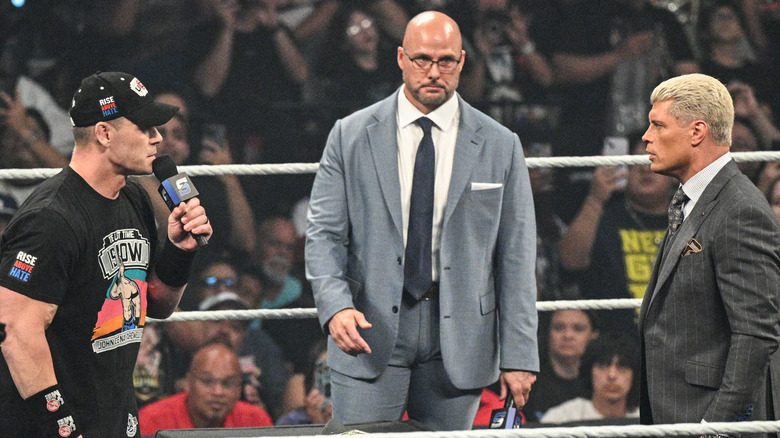 John Cena, Adam Pearce, and Cody Rhodes during the signing segment on the July 18th episode of 