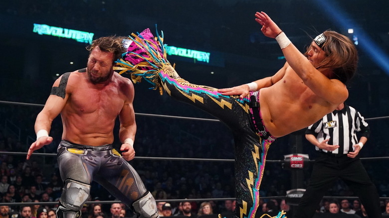 Nick Jackson hitting Kenny Omega with a superkick