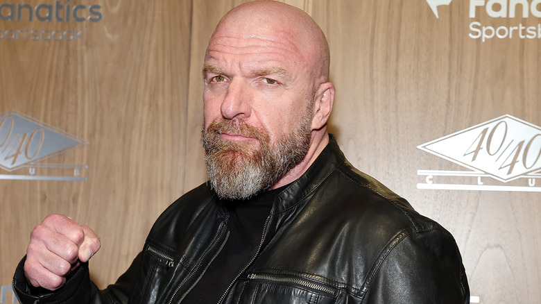 Triple H wearing a black leather jacket