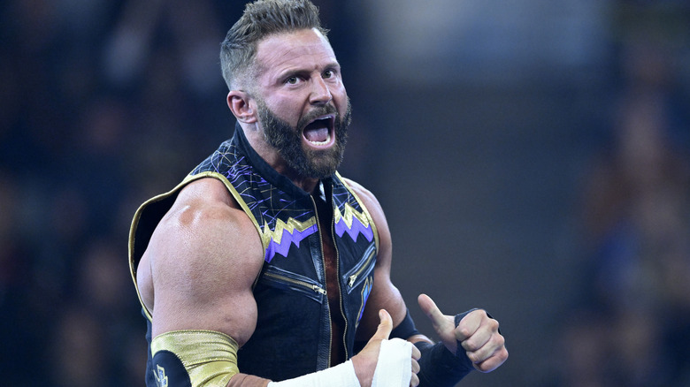 WWE star Matt Cardona points at himself in confidence during one of his matches