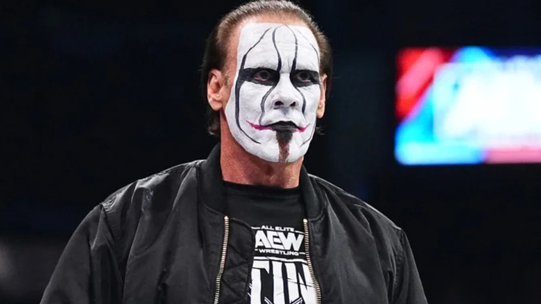 Sting wearing black and white face paint 