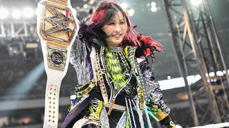 IYO SKY holding up the WWE Women's World Championship