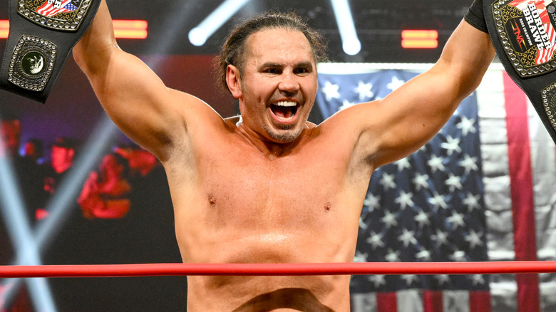 Matt Hardy holding two TNA championship belts