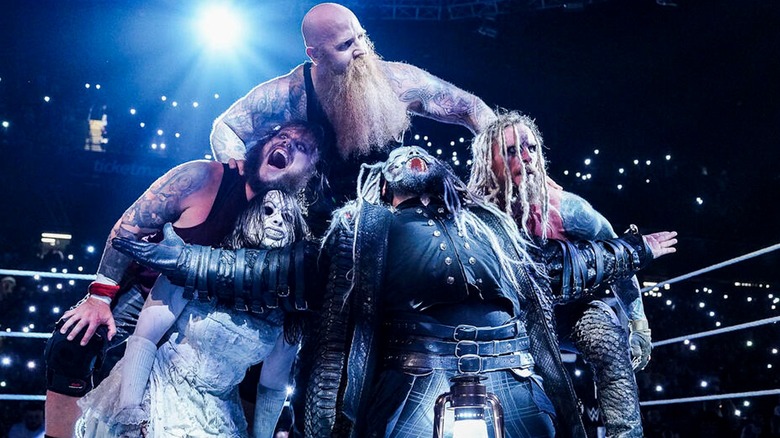 The Wyatt Sicks stable posing together during a WWE show.