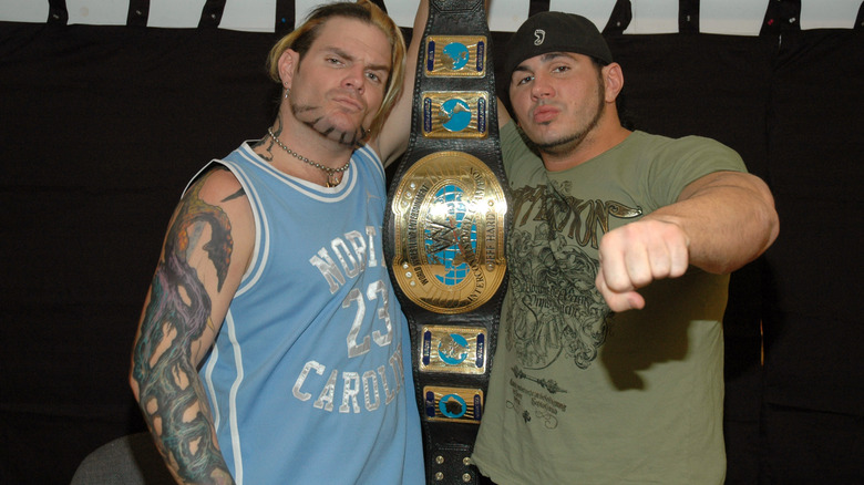 Jeff and Matt Hardy posing together with tag belt