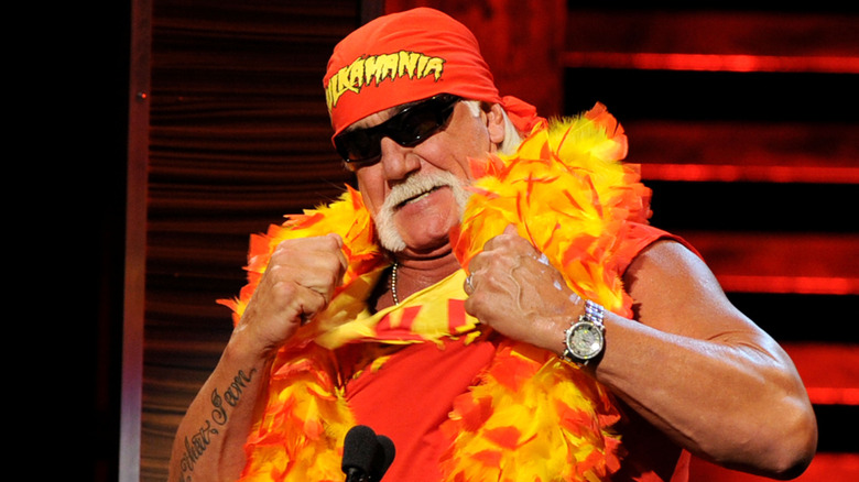 Hulk Hogan tearing his shirt at a podium