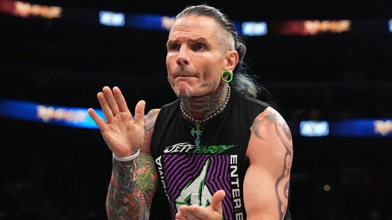 Jeff Hardy in ring clapping to his theme song during an AEW show