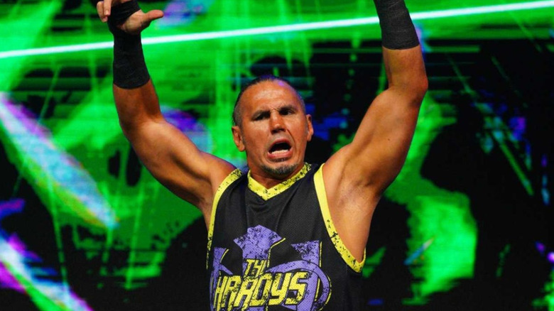 Matt Hardy poses with brother Jeff Hardy on the stage before match on 