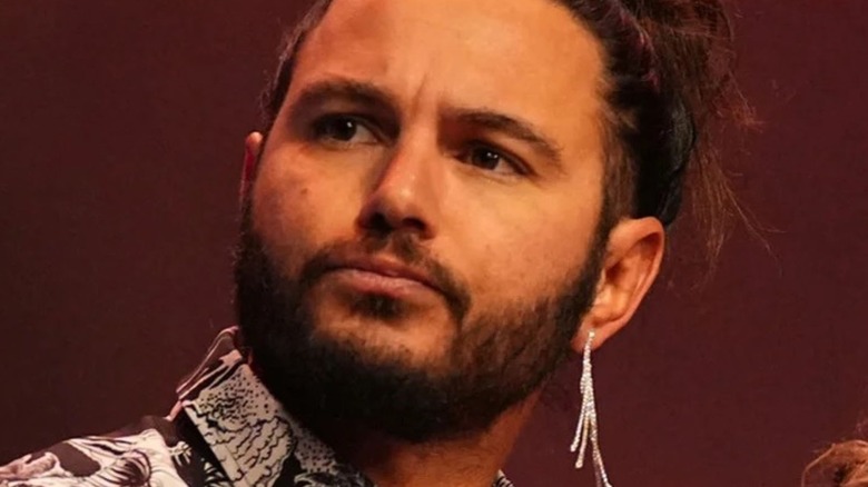 AEW's Matt Jackson stands on stage before making his way to the ring for a match.