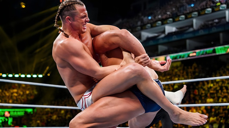 Matt Riddle with submission hold on GUNTHER
