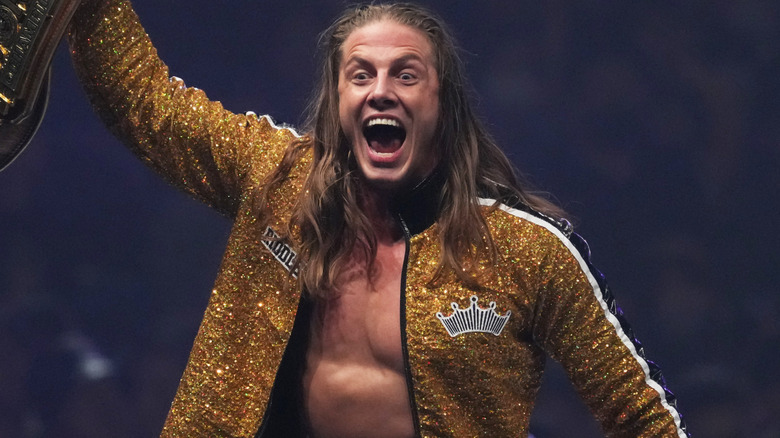 Matt Riddle wearing a sparkly gold jacket